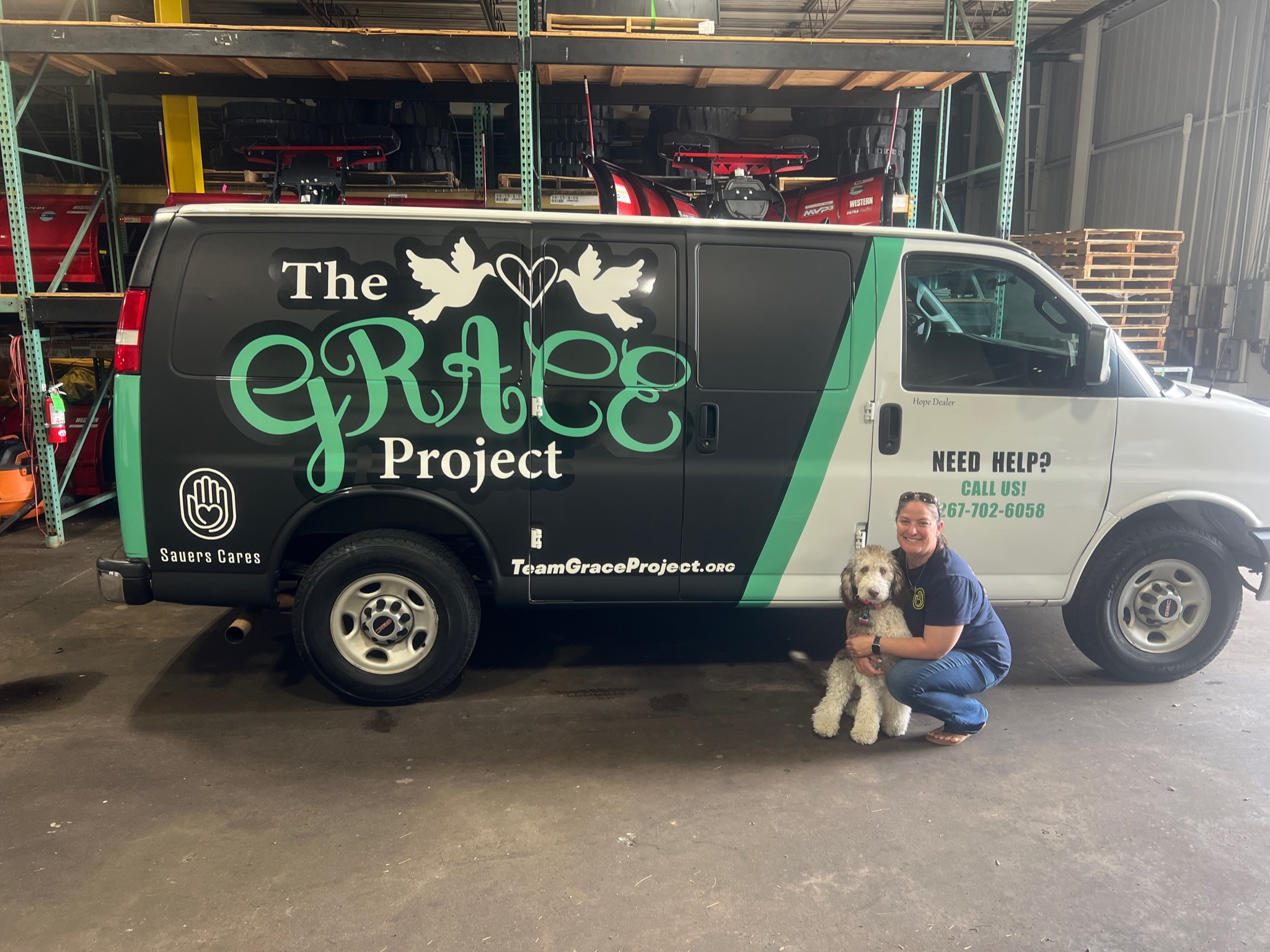 Steph with The Grace Project wrapped van funded by Sauers Cares